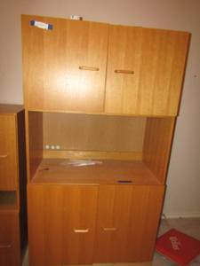 lot 40 image: 653618  small wooden childs desk 2 top doors, open middle and 2 bottom doors, light brown wood