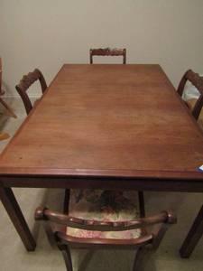 lot 119 image: Wooden dining table 28 x 60 x 40 with 2 leafs sizes are 1840 ,  Comes with 4 chairs, made 1081973