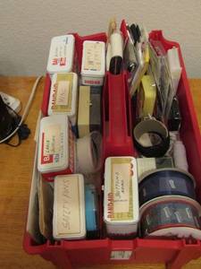 lot 394 image: Red small tote with handle, full of sewing items such as thread, needles, saftey pens, buttons and much more