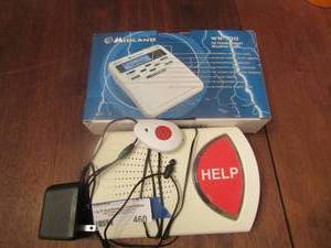 lot 460 image: Midland weather radio, Help machine for elderly, Model# fs418mxy-1, comes with neck necklace as well with push button alert