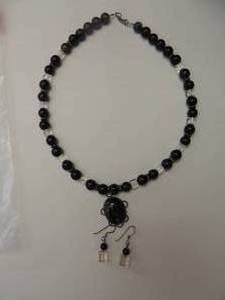 lot 143 image: dark purple and ice matching necklace and earring set