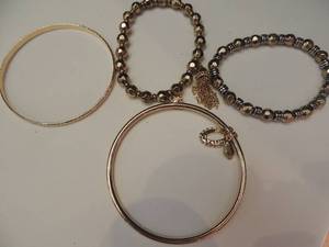 lot 134 image: 2 gold bangle bracelets and 1 beaded