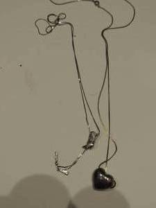 lot 156 image: 1 puffed heart necklace and one southwest style boot lasso necklace