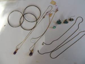 lot 24 image: Necklace- gold chain with purple drop single turquoise earrings silver bracelet and 2 chains