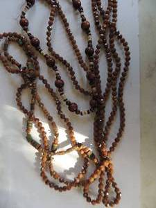 lot 28 image: Six total wood bead and brown bead necklaces