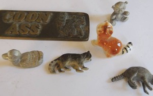 lot 108 image: Panther, Raccoon, Duck, bear, ceramic Raccoon and raccoon key fob