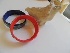 lot 59 image: 2 artesian bracelets ( blue green and red) and clay dinosaur
