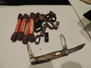 lot 94 image: Western 3 blade P.K. and 4 Bruce 36 shoe laces plus lot of leather belt loops