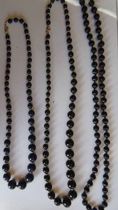 lot 65 image: Three beaded necklaces- black, black & gold, and lapis blue