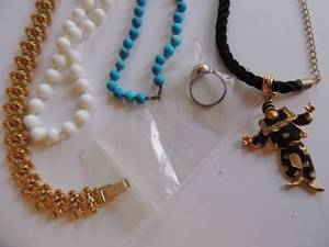 lot 311 image: Adjustable ring, white beads, blue beads, gold necklace and clown necklace