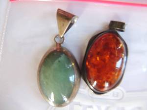lot 328 image: 2 pendants sterling and jade  and sterling and amber