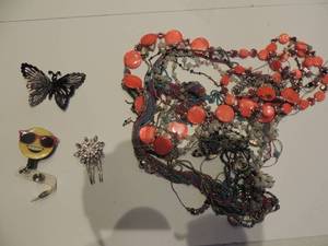 lot 248 image: wad of necklaces, butterfly hairpin and badge holder