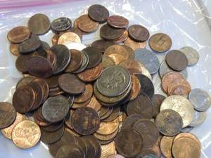 lot 212 image: Penny saved is a penny earned jug full of coins (more than $5)