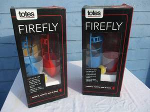 lot 75 image: 2-NIB-FireFly DayNight Ball Toss Game With Glow In The Dark Ball And LED Base In The Catcher For Night Play, Note 2 x Money
