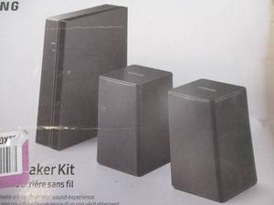 lot 76 image: Samsung Model SWA-8500-S Wireless Rear Speaker Kit For Samsung Sound Bar With Power Cord. Looks Unused.