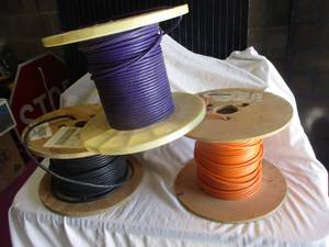 lot 90 image: 3-Spools of Wire, Unknow Amount,1-Orange-4Pr,24Awg, Cat5,..1-Purple-4Pr,55J4, Cat5,.1-Black 2-Wire RedBlack, 3 x money