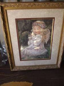 lot 125 image: Angel Holding Rabbit Print, Frame Is About  18 x 21-H