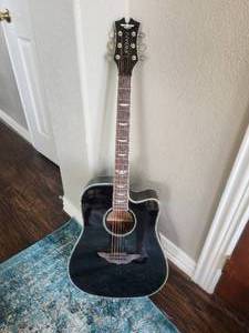 lot 8 image: Very nice Keith Urban Guitar (Like New-maybe) and a nice backpack carry case