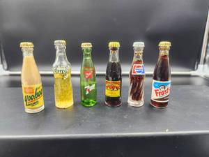 lot 96 image: Selection of vintage miniature glass soda bottles