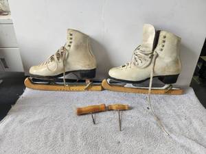 lot 157 image: Vintage pair of white ice skated with blade covers and pulls - Riedell Royal, Red Wing, Mn.