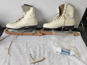 lot 232 image: Vintage pair of white ice skated with blade covers and pull - Riedell, Red Wing, Mn.