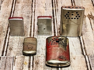 lot 165 image: Three Vintage Lighters (Zippo, Park, &amp Camel) &amp Two Vintage Hand Warmers - Including a Jon-E