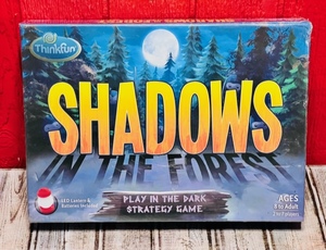 lot 188 image: ThinkFun Shadows in the Forest Play in the Dark Strategy Game - New in Sealed Box