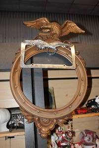 lot 19 image: Vintage Round Eagle Frame and Auto Eagle Liscense Plate Cover