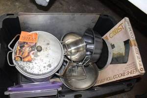 lot 159 image: Tub of Misc Bakeware, including 2 cake pan lids, cookie sheets, cooling racks, bunt pan, round cake pan, Jelly Roll Cookie Sheet in orginal box