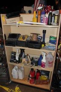 lot 45 image: Shelving and Contents, Cleaning supplies, Auto chemicals, Car Stereos, and much more as shown