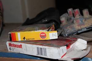 lot 34 image: Misc Automobile Parts For Dodge, Oldsmobile, Spark plugs, light Bezels, antennas, rotors and more as shown
