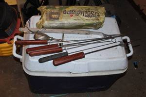 lot 42 image: Camping Items, fire log, metal skewers, nut cracker and ice chest