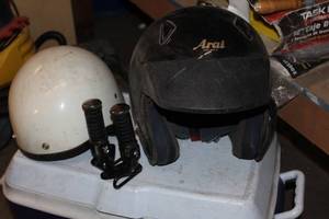 lot 56 image: Two Motorcycle Helmets and Pair of Motorcycle Foot Pegs