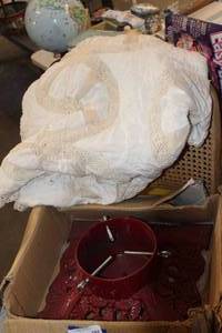 lot 182 image: $$ Cast Iron Christmas Tree Stand and Vintage Hand Made Tree Skirt
