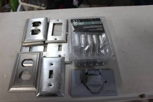 lot 328 image: Variety of Stainless light Switch and Electrical Outlet Covers, also an outdoor outlet cover and Nickle Drawer pulls