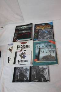 lot 56 image: Strategy Guides and Games Warcraft II, Phantasmagoria, In the 1st Degree, Psychic Detective