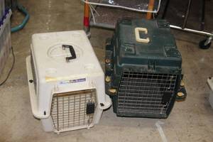 lot 57 image: (2) Pet Carriers - Green (has rollers) 21x17 and white 21x16 carriers