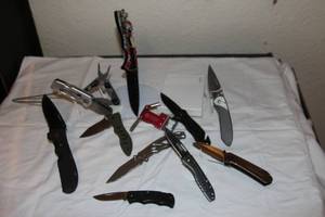 lot 65 image: Pocket Knives Cutco, Gerber, Bass Pro Shops, Coast, Husky, Camillus, Gerber, Albatross, Buck brands plus Confederate flag knife with engraved initials