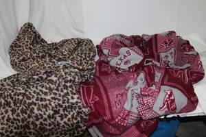 lot 92 image: (2) Snuggie blankets Texas A&M, Animal print