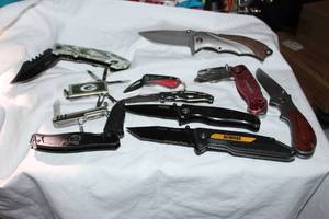 lot 68 image: Pocket knives DeWalt, NRA, Sheffield, Klein tools, Gerber, Green Bay Packers knife, Master brands and more