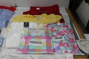 lot 133 image: Womens Clothes pink, yellow and red tops and white pants most have tags
