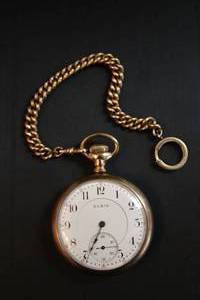 lot 181 image: Elgin Pocket watch w 12K Gold Filled watch fob chain with large o-spring clasp. Marked 12K GF. Please preview.