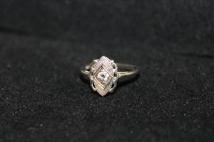 lot 186 image: 10K White Gold and Diamond ring. Marked 10K. Size 4.5. Diamond tested.