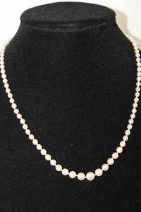 lot 187 image: 10K White gold and graduated cultured Pearl strand. Marked 10K. 18L