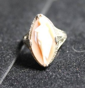 lot 199 image: 14K white gold antique Victorian carved conch shell cameo ring w stylized female silhouette form. Marked 14K. Filigree table. Size 4