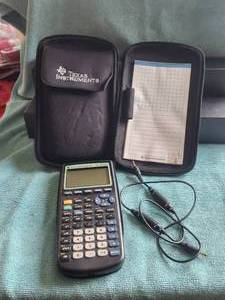 lot 10 image: Texas Instrument TI-83 Plus calculator and case