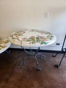 lot 253 image: Artist signed clay tabletop featuring birds, monkey, and butterflies amongst hibiscus flowers on white background -Table base included - 38D x 31H - Bldg. J