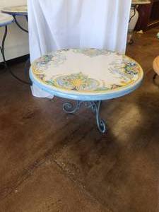 lot 70 image: Clay tabletop with pomegranates on crackled white background -Table base included - 33D x 19H - Bldg. J