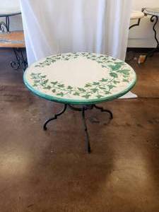 lot 130 image: Artist signed lava and clay tabletop with ivy motif on crackled white background -Table base included - 32D x 20H - Bldg. J