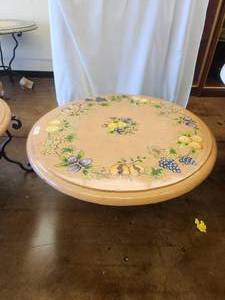 lot 210 image: Clay tabletop featuring grapes, pomegranates, lemons, pears, and plums all on a tera cotta background -Table base included - 39D x 19H - Bldg. J